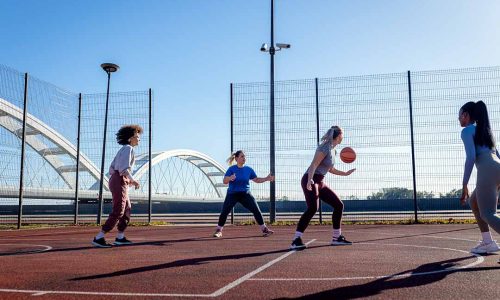 Diverse group of young woman having fun playing recreational bas Diverse group of young woman having fun playing recreational bas